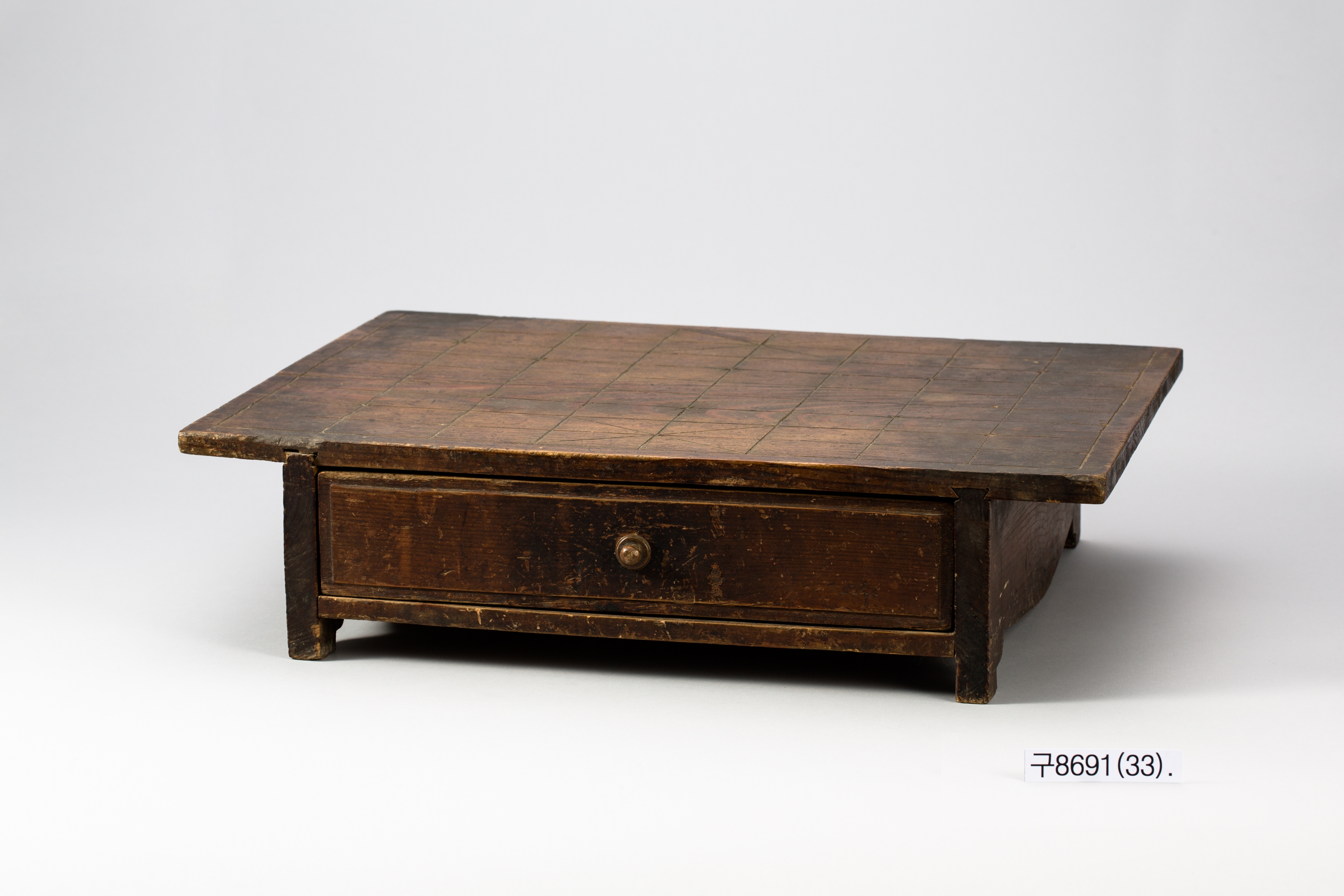 A Joseon wooden Janggi board with legs and a drawer below the grid